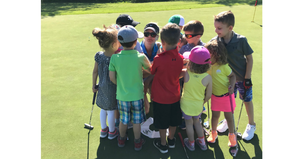 Group of junior golfers with instructor Emily Burns at Cantigny Golf in Wheaton, Illinois