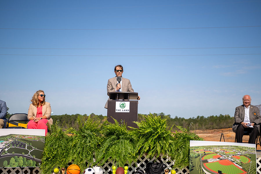 A speaker giving a speech at the Saraland Groundbreaking ceremony.